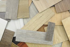 , Samples Of Laminate And Vinyl Floor Tile On Wooden Backgroun